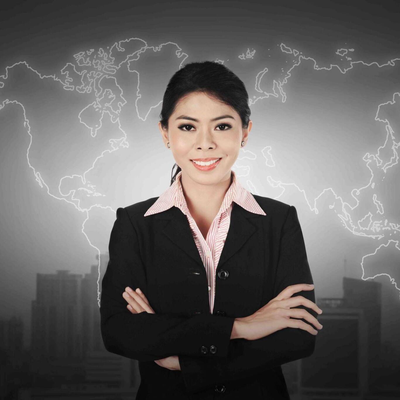 Business woman standing in front of world map