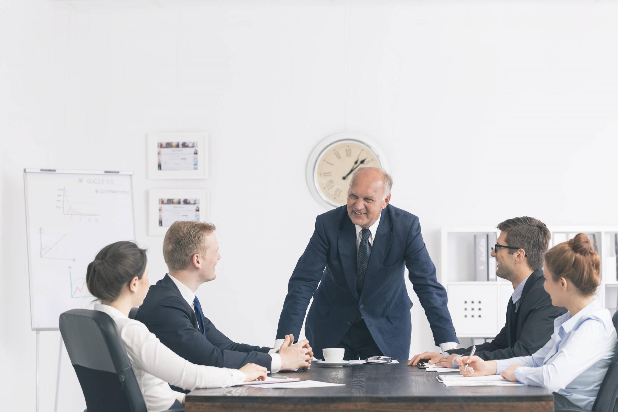 Corporate meeting with a relaxed boss