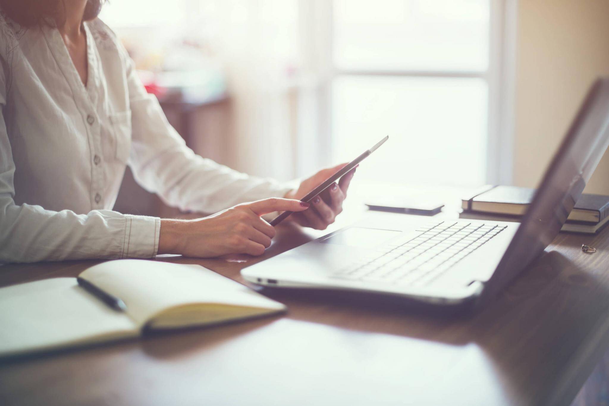 business woman hand working laptop computer on wooden desk.