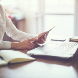 business woman hand working laptop computer on wooden desk.