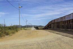 US Mexico border wall looking east from Naco, Arizona