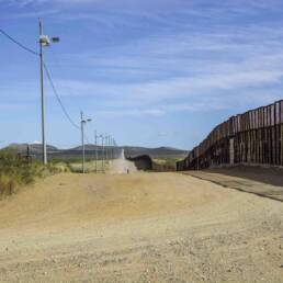 US Mexico border wall looking east from Naco, Arizona