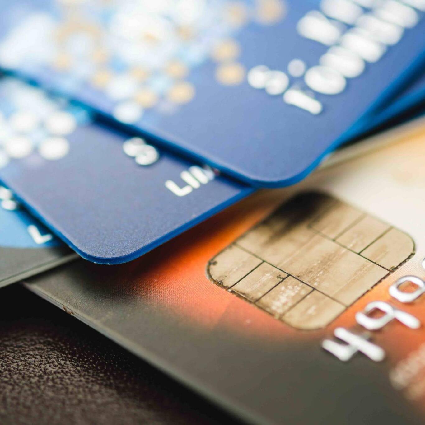 Credit cards stacked, old credit cards in brown and blue color