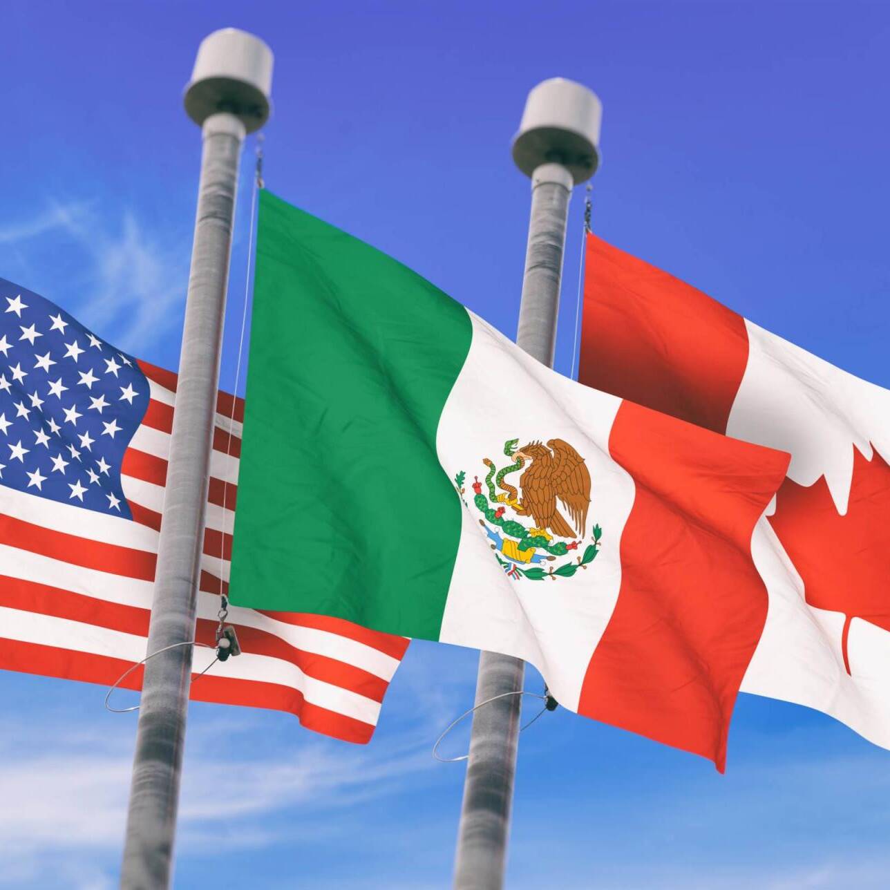 Canada, Mexico and US Flags over blue sky, conceptual image for Nafta agreement (3D rendered image)