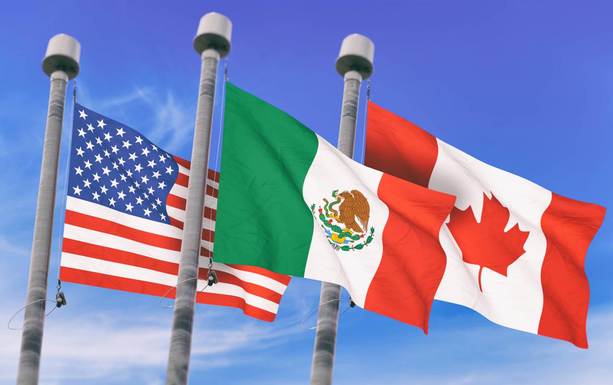 Canada, Mexico and US Flags over blue sky, conceptual image for Nafta agreement (3D rendered image)