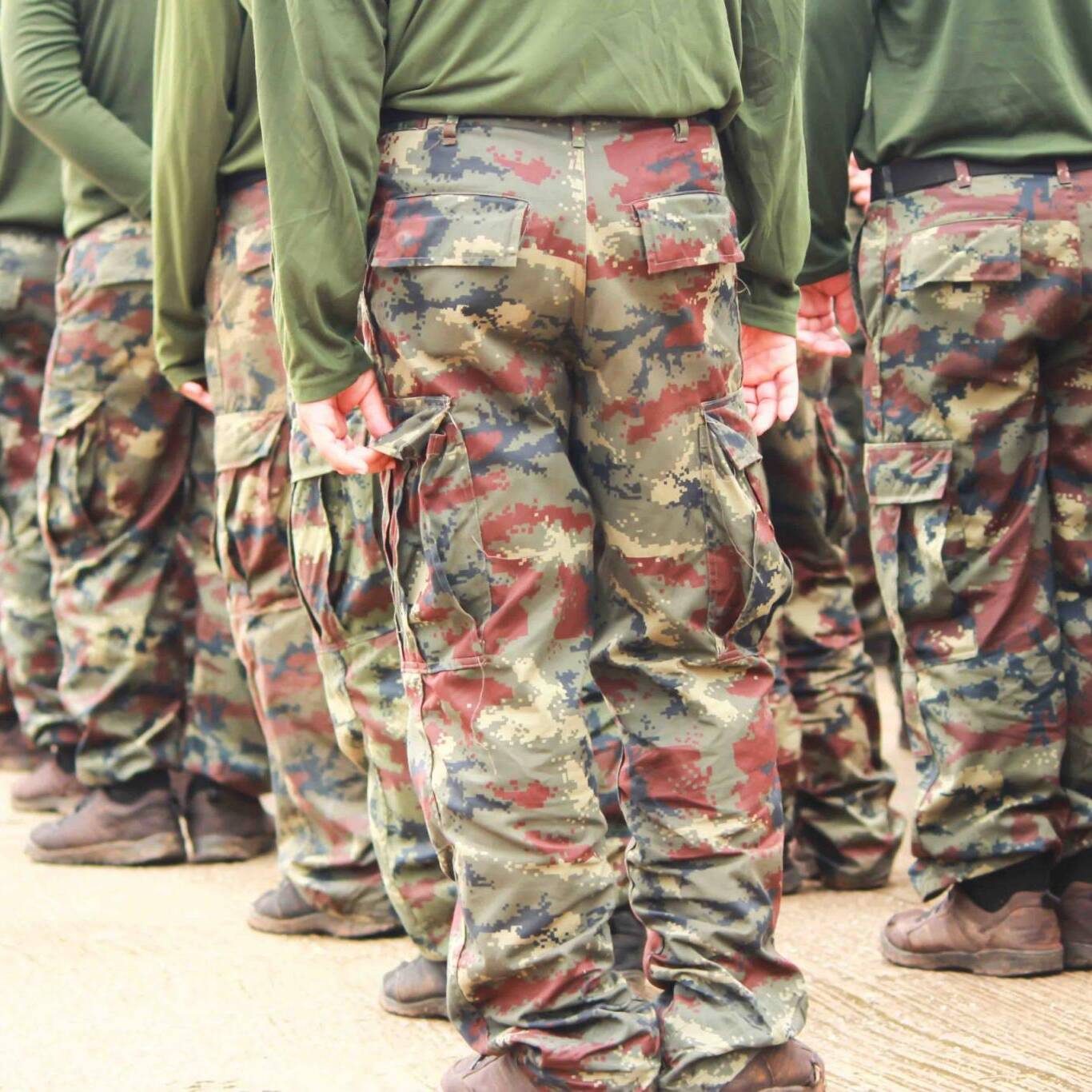 Soldiers in camouflage military uniform in rest position