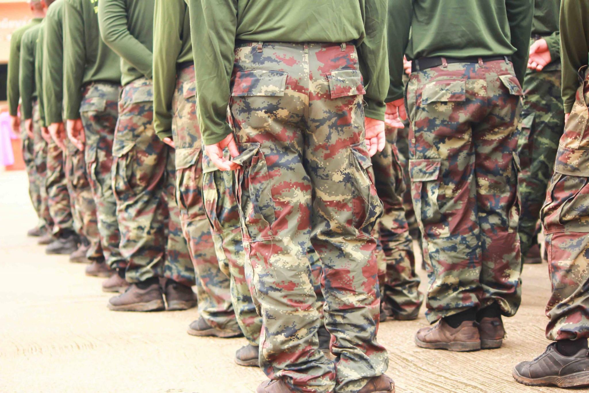 Soldiers in camouflage military uniform in rest position