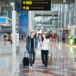 Asian couple tourist at the international airport.