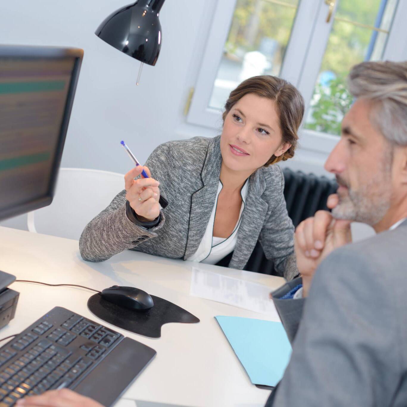 man dealing with a financial adviser at the bank