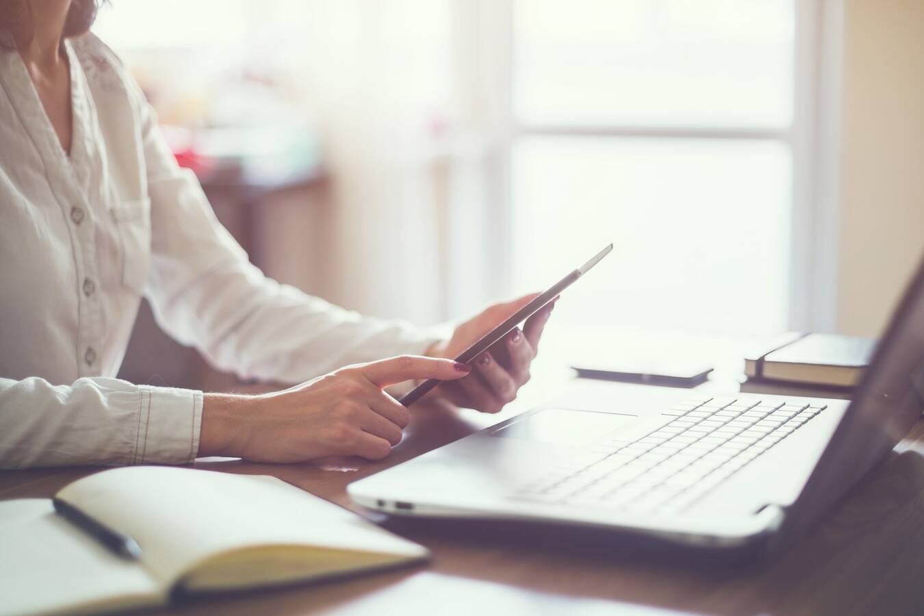 business woman hand working laptop computer on wooden desk.