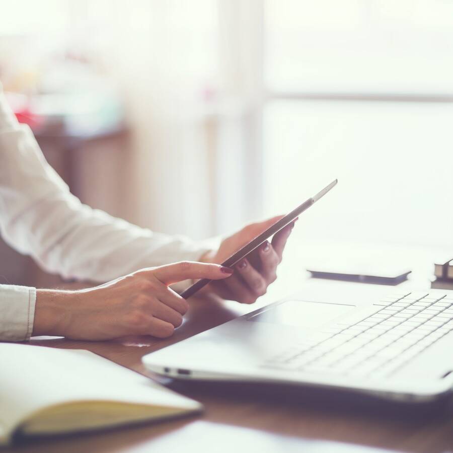 business woman hand working laptop computer on wooden desk.