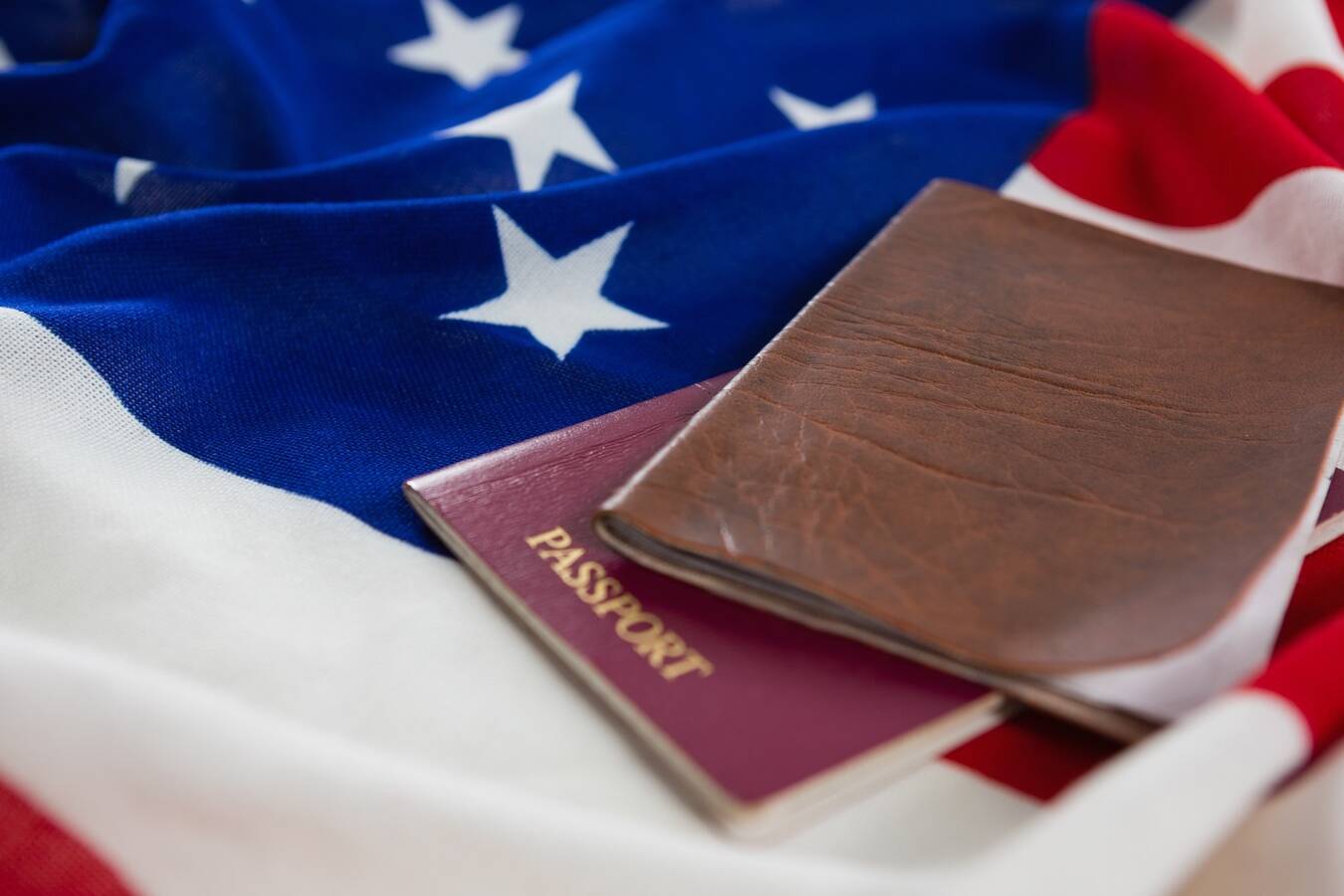 Passport and visa on an American flag