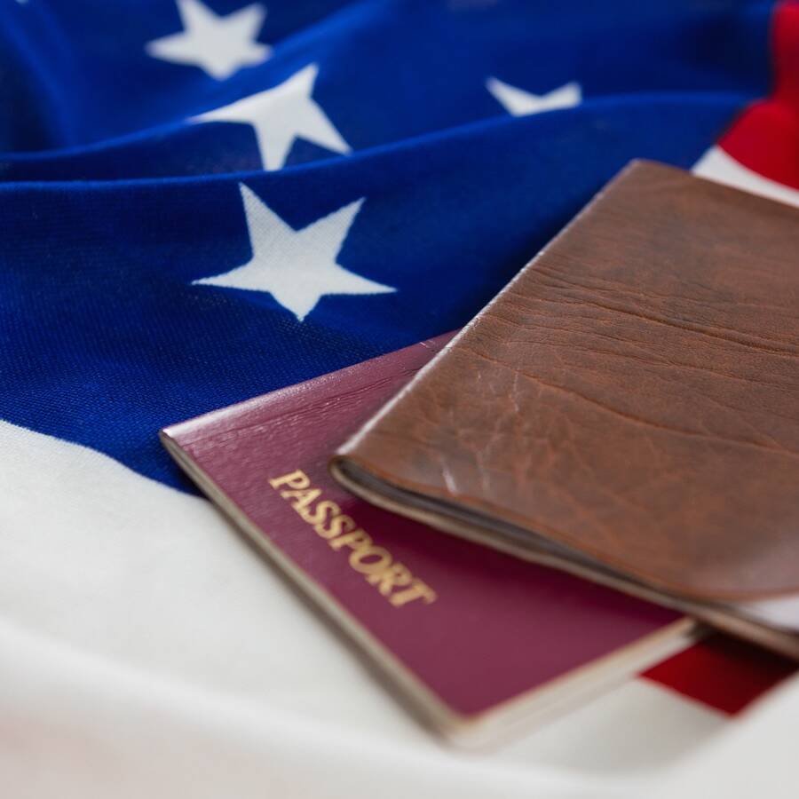 Passport and visa on an American flag