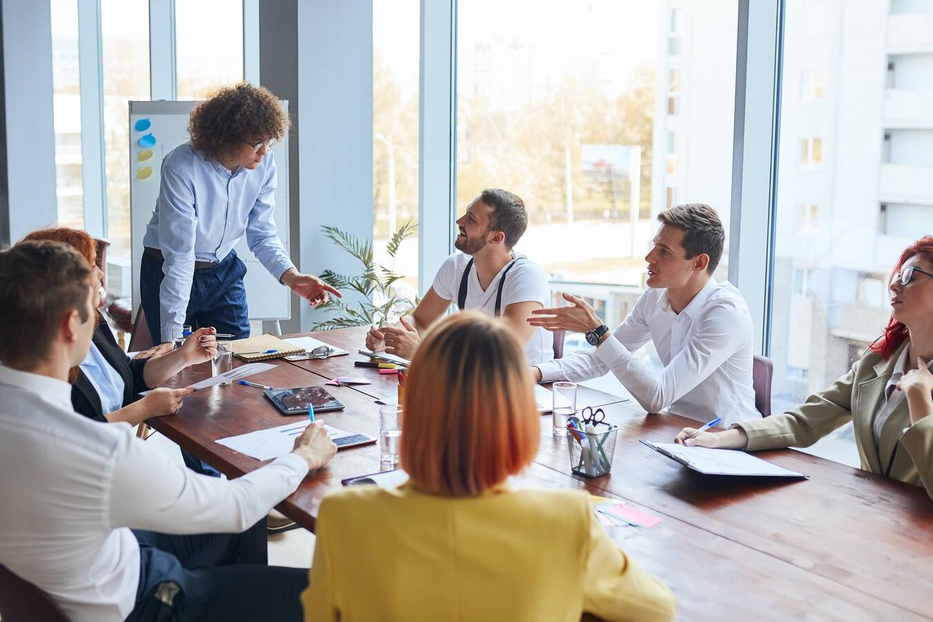 Personable business leader of team speak with colleagues