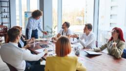 Personable business leader of team speak with colleagues