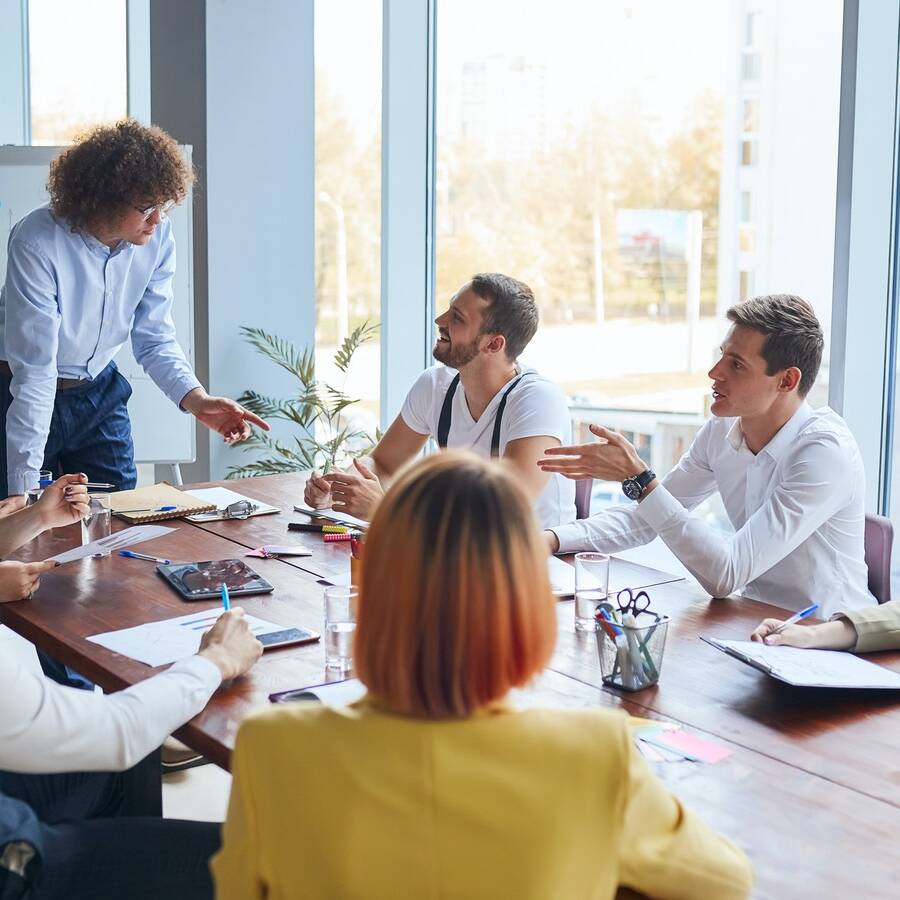 Personable business leader of team speak with colleagues