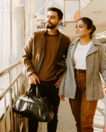 indian couple traveling in airport