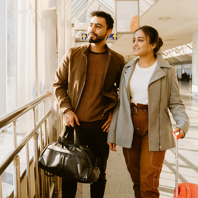 indian couple traveling in airport