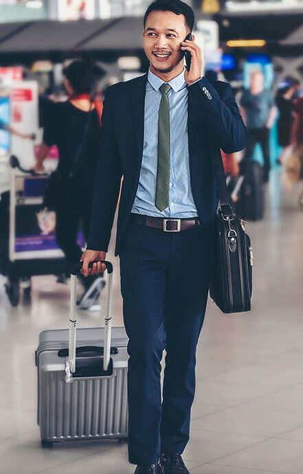 businessman in airport on phone